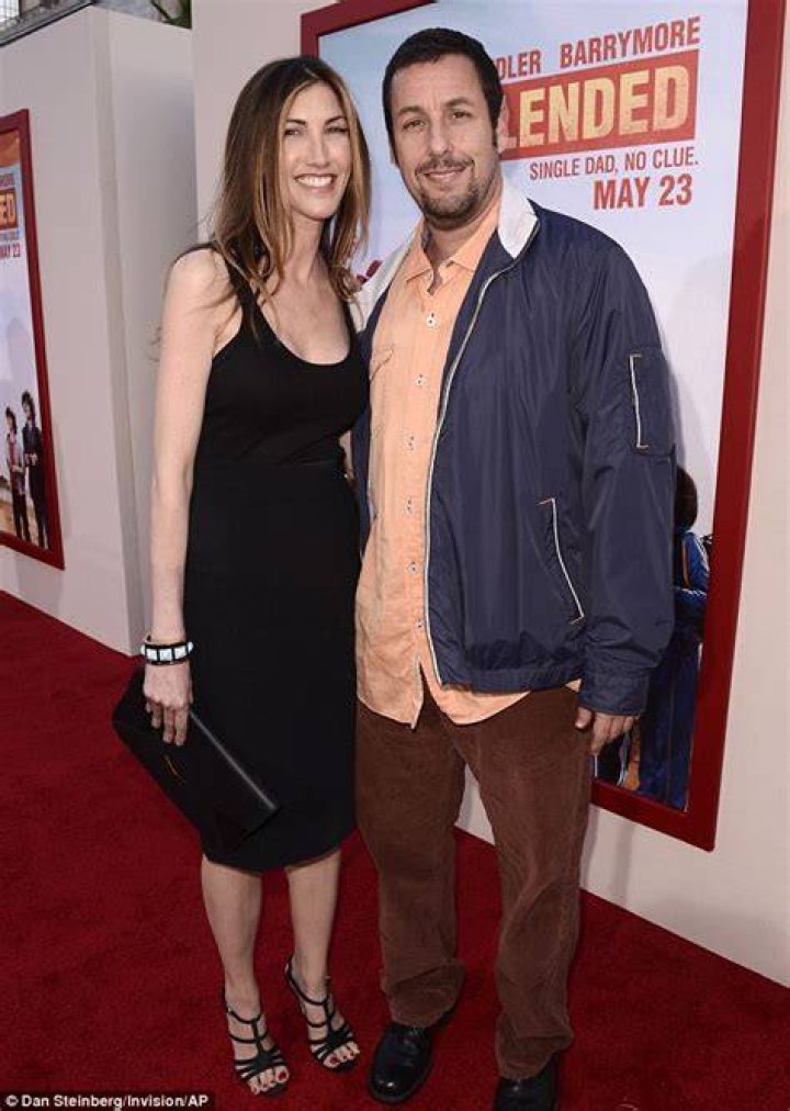 Adam Sandler upstaged by his glamorous wife Jackie as they arrive to