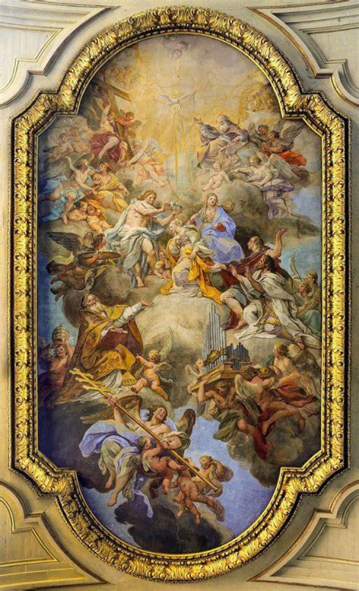 an ornate painting on the wall of a building