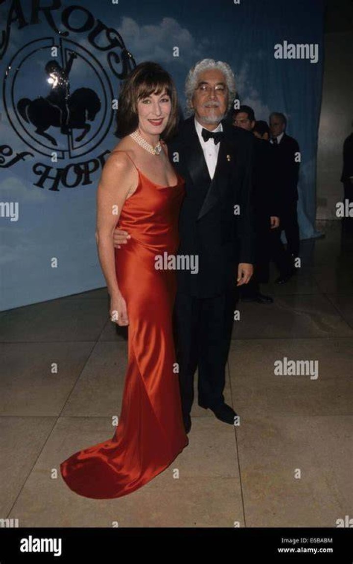 ANJELICA HUSTON with husband Robert Graham at the Emmy Awards Stock