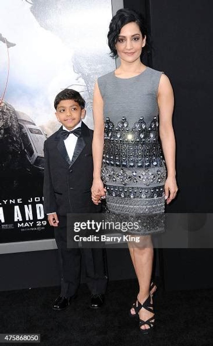 Archie Panjabi and son 063 at the San Andreas Premiere at the TCL