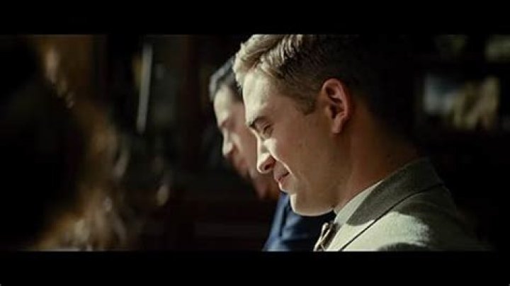 August (Christoph Waltz) and his wife, the beautiful Marlène (Reese