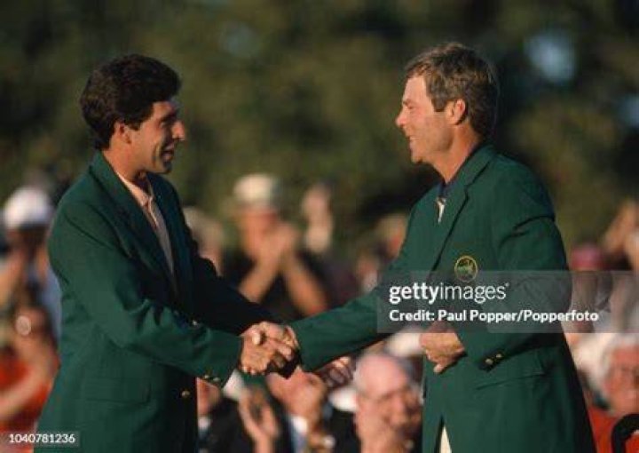Ben Crenshaw of the United States with his wife Julie as she tries on