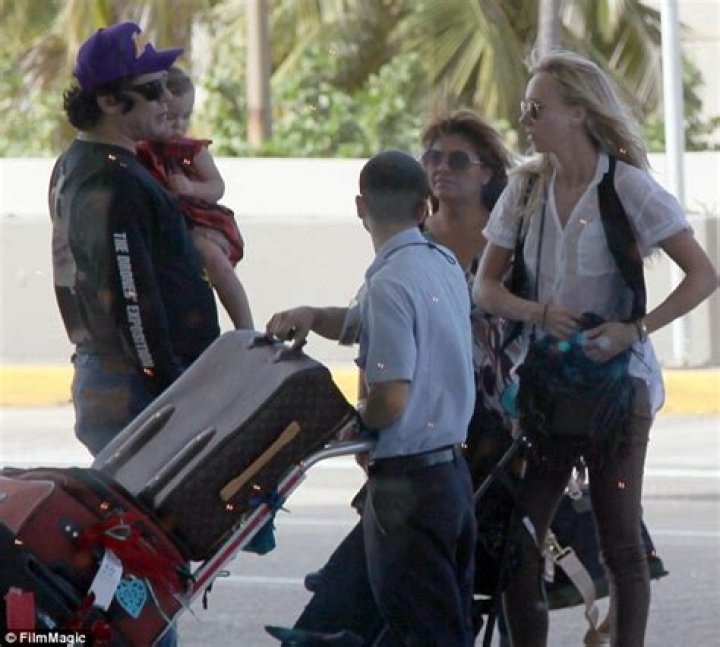 Benicio Del Toro coos over baby Delilah as actor and Kimberly Stewart