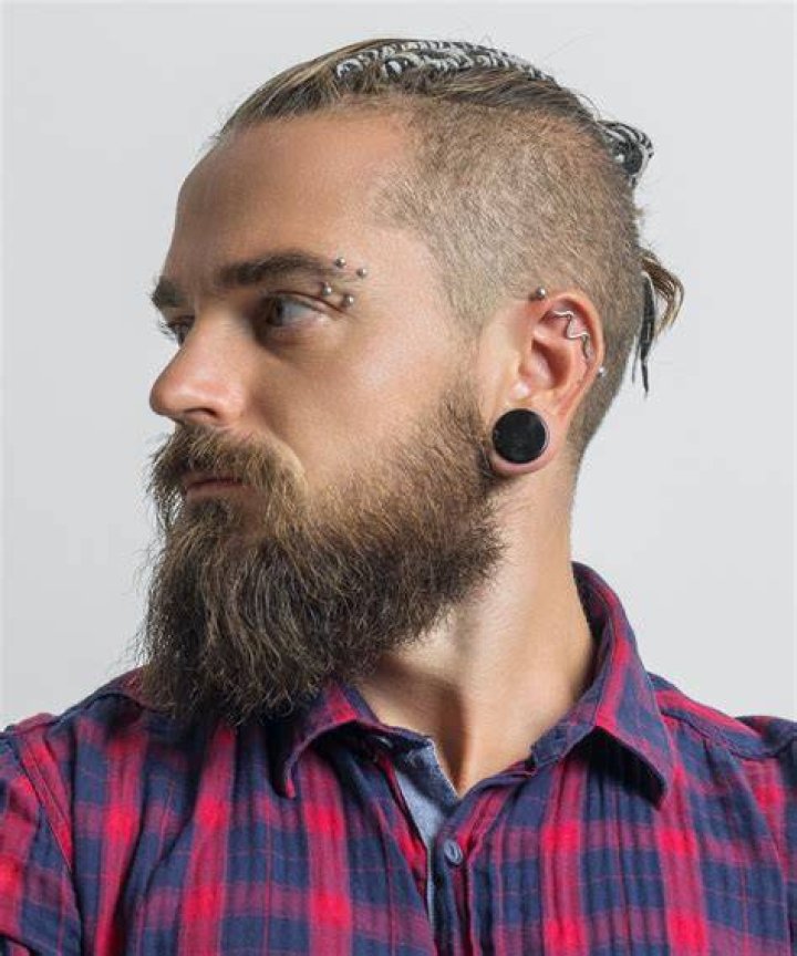 Blonde Haired Man with Piercings Mug Shot