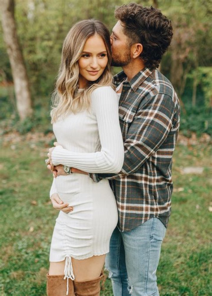 Chris Lane Kisses Pregnant Wife Lauren Bushnell in Christmas Photo