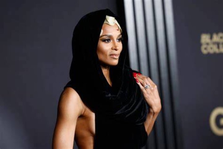 Ciara goes topless as she twerks balancing a bottle of rum on her HEAD