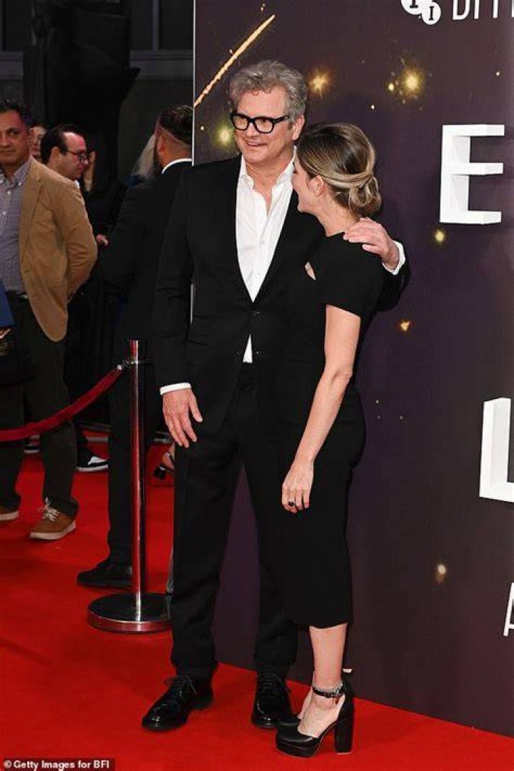 Colin Firth cosies up to girlfriend Maggie Cohn as they make their red