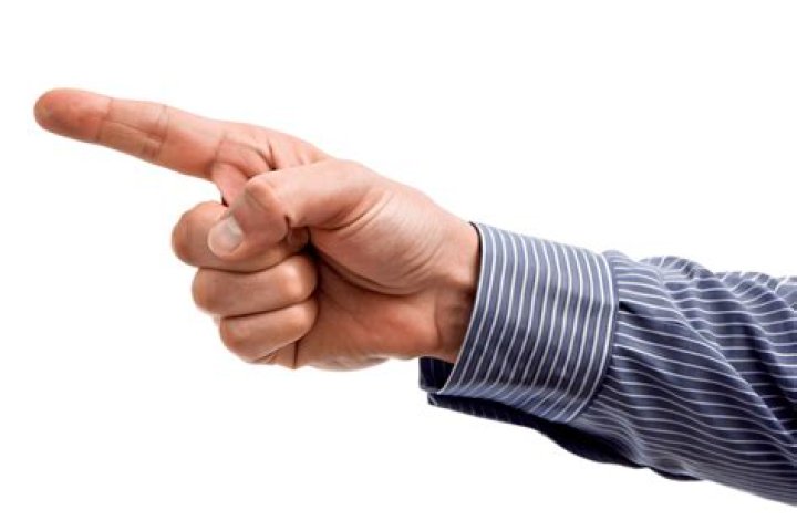 Download A Man Is Pointing His Finger At The Camera Wallpaper