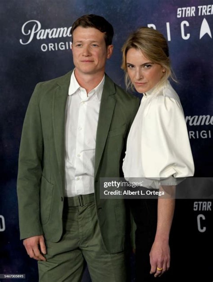 Ed Speelers and Asia Macey attending the 72nd British Academy Film