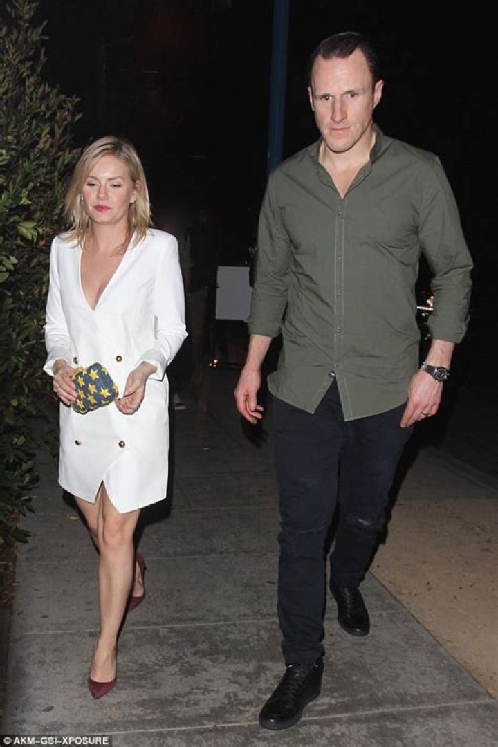 Elisha Cuthbert bares cleavage on chilly date with hockey husband Dion