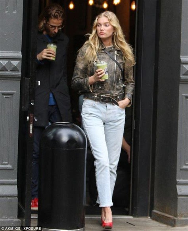 Elsa Hosk cuts a stylish figure as she walks arm in arm with beau Tom