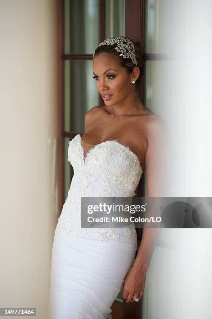 Evelyn Lozada poses for photos at her wedding to Chad Ochocinco at Le