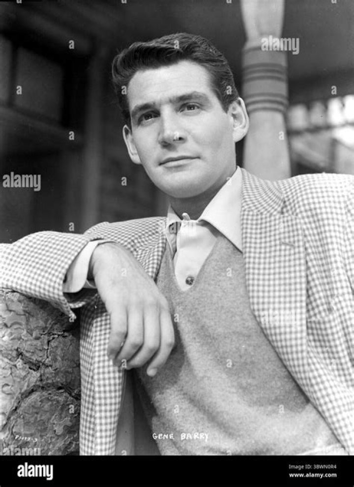 Gene Barry wearing a gingham jacket outdoors Photo Print (24 x 30