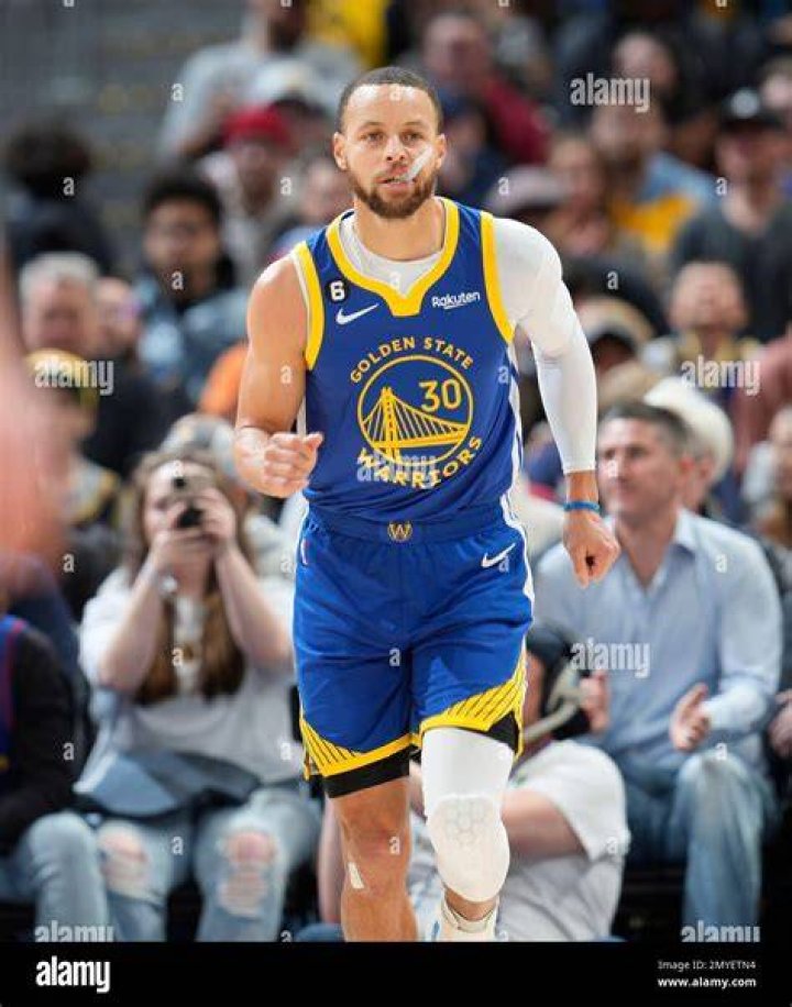 Golden State Warriors guard Stephen Curry speaks with his daughter