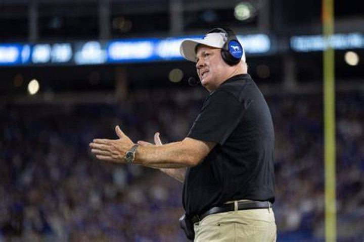 Head coach of the Kentucky Wildcats Rich Brooks looks up at the