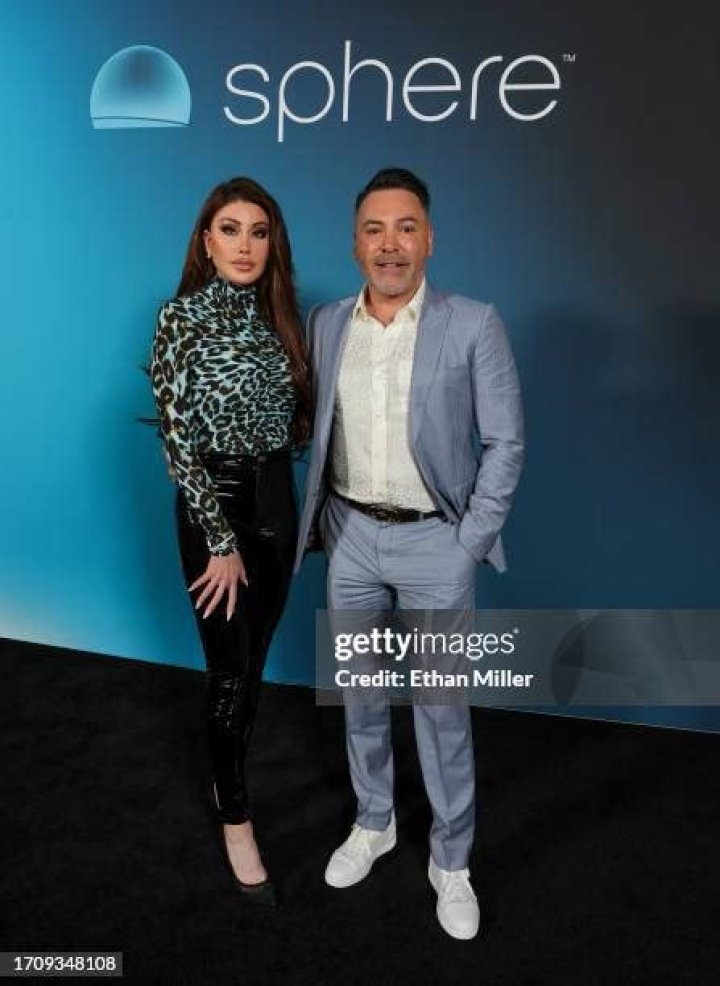 HOLLY SONDERS and Oscar De La Hoya Out in Beverly Hills 05/27/2022