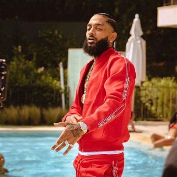 Image of Nipsey Hussle with his wife Lauren London