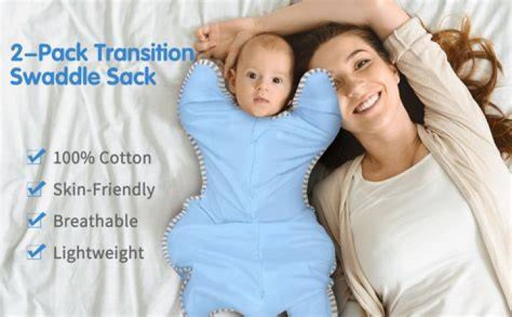 Is it OK to swaddle baby with arms out? ·