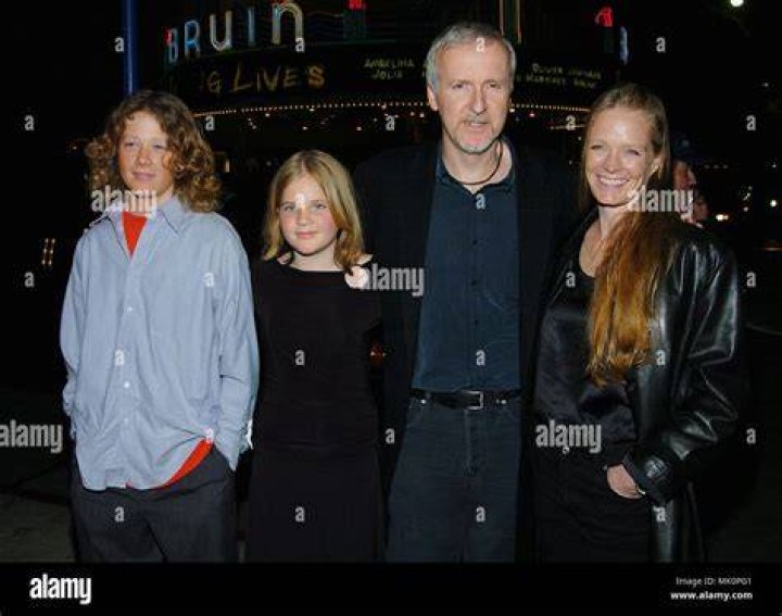 James Cameron with wife Suzy Amos and daughter and son arriving at the