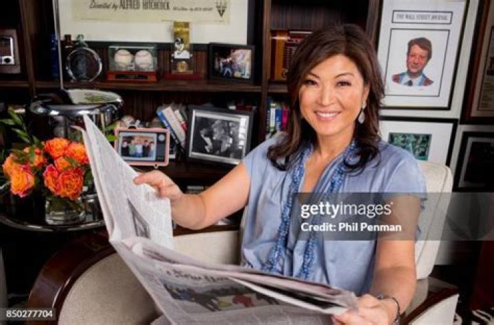 Journalist Juju Chang is photographed with husband Neal Shapiro, sons