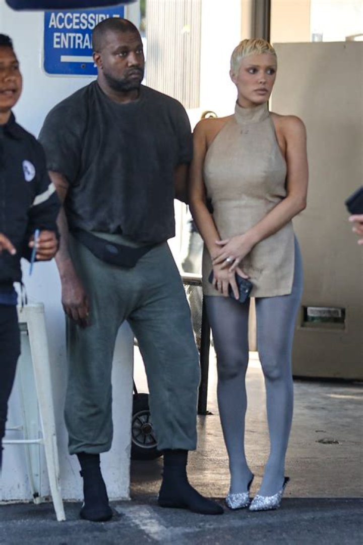 Kanye West squeezes wife Bianca Censori's butt and buries his head in