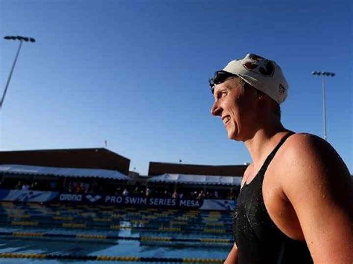 Katie Ledecky wore a cap and gown over her bathing suit to celebrate