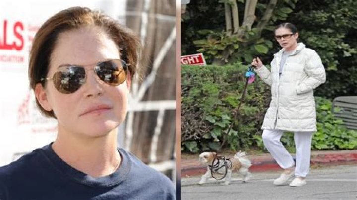 Lara Flynn Boyle, 50, looks unrecognizable as she steps out with pup in