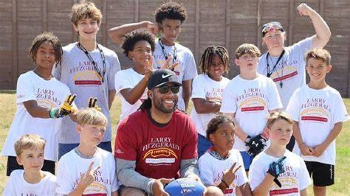 Larry Fitzgerald making this kids day! What a great pic! Kid day