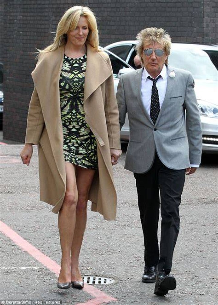 Leggy Penny Lancaster dwarfs husband Rod Stewart as he escorts her to