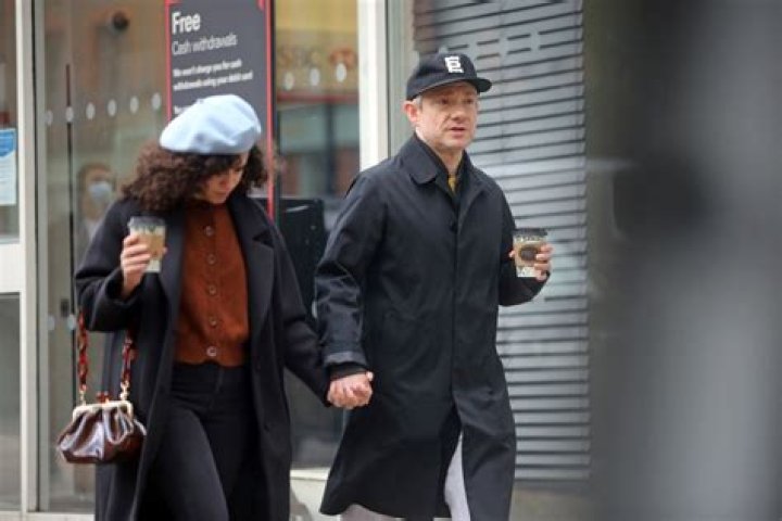 Martin Freeman holds hands with mystery woman four years after split