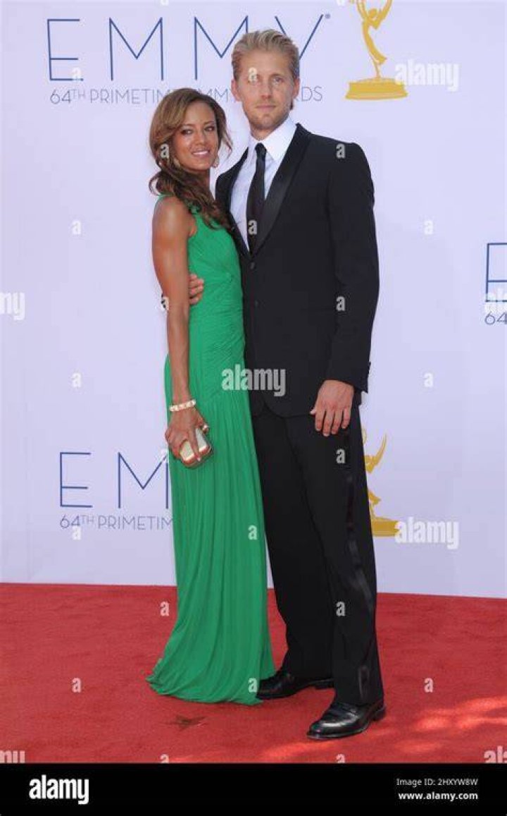 Matt Barr and Heather Hemmens attends the 64th Primetime Emmy Awards