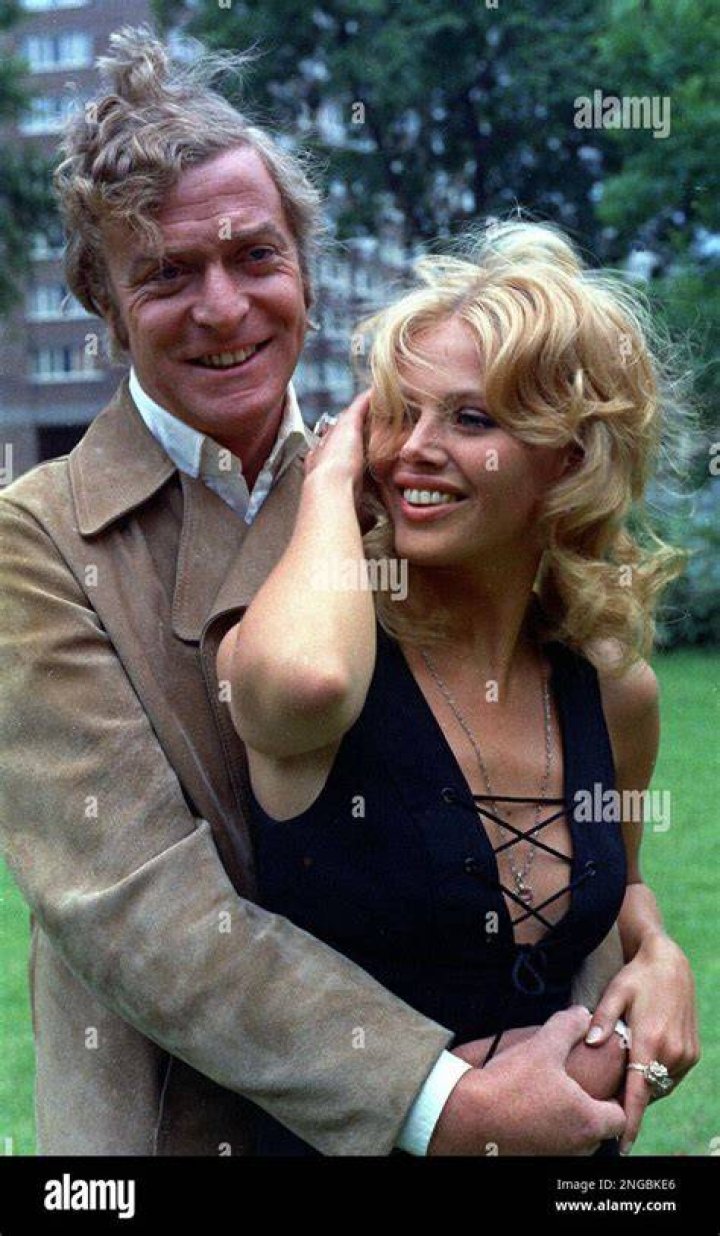 Michael Caine and Britt Ekland, are seen during a break in the filming