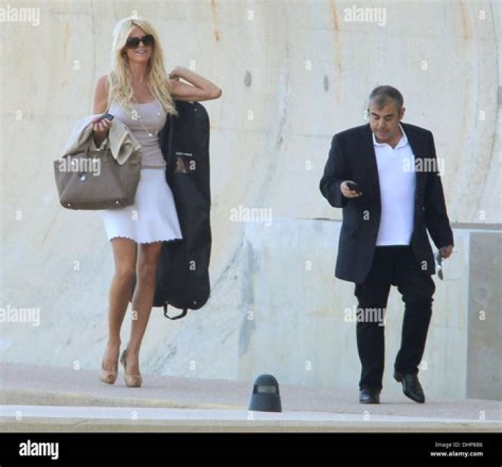 Model Victoria Silvstedt and her boyfriend Maurice Dabbah walking along
