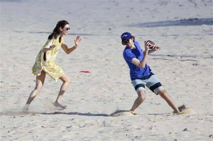 Nancy Shevell Plays American Football on a Beach in SaintBarthelemy