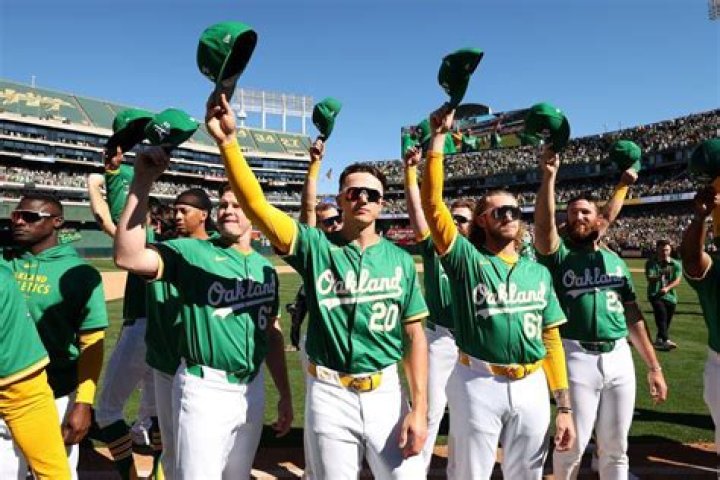 Oakland Athletics' Mark Kotsay and supermodel Monika Schnarre chat with