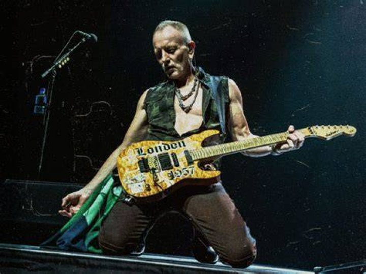 Phil Collen (L) and his wife Helen Simmons visit 'Rain A Tribute To