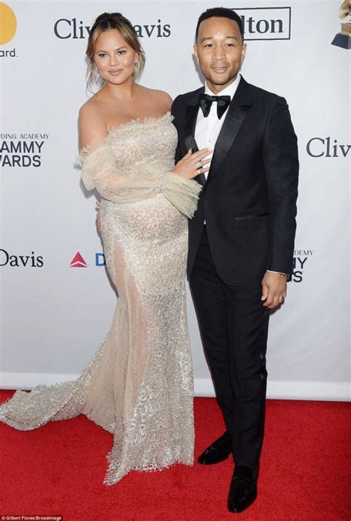 Pregnant Chrissy poses with John at Clive Davis bash Daily Mail Online