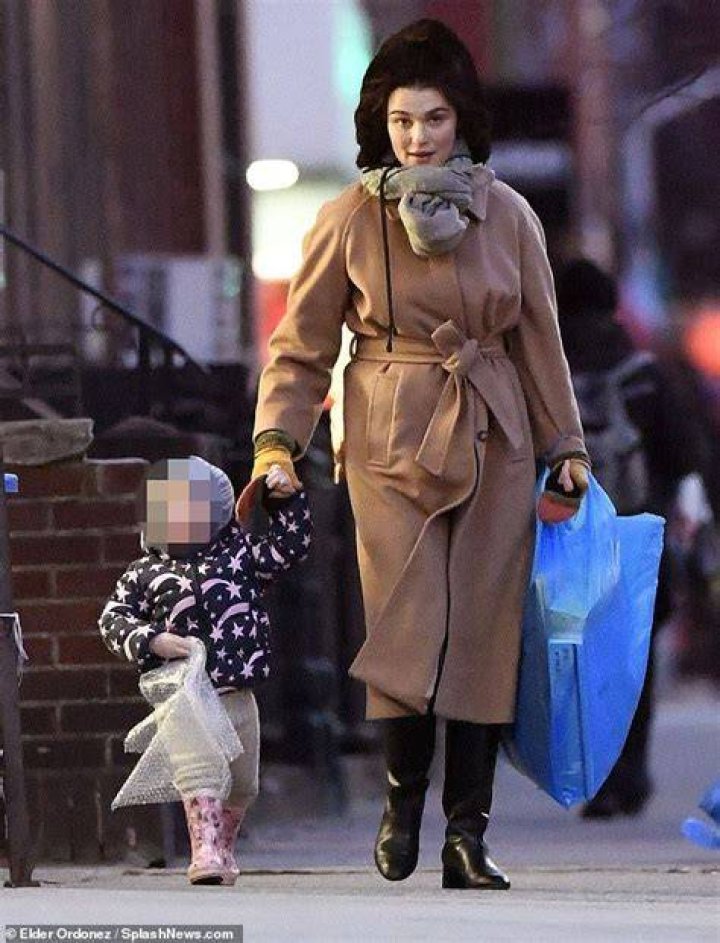 Rachel Weisz wraps up in hat and scarf set as she takes son Henry