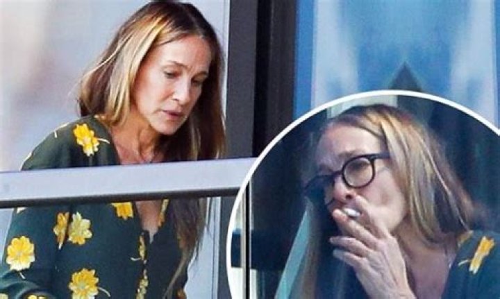 Sarah Jessica Parker smokes a cigarette on her Sydney hotel balcony
