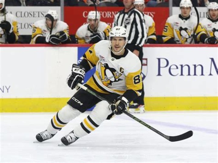 Sidney Crosby, NHL, Pittsburgh Penguins. He's so cute when holding that