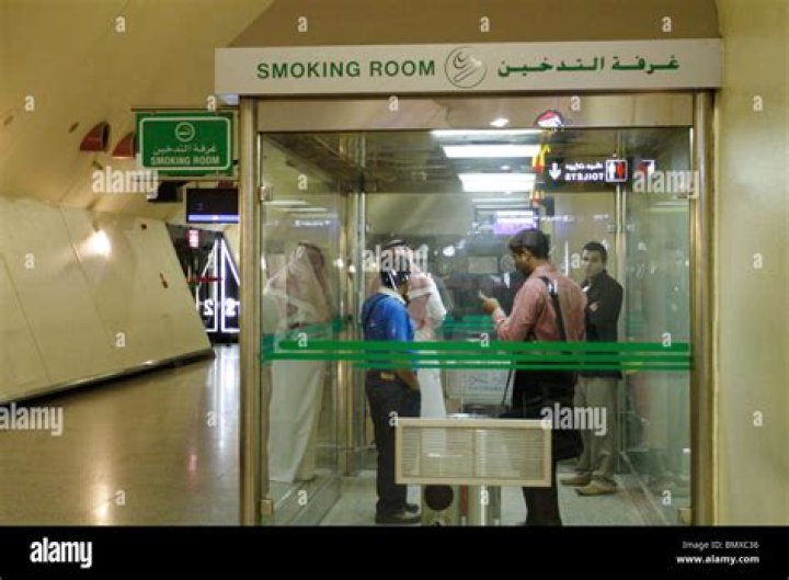 Smoking room at Kuwait Airport Stock Photo Alamy