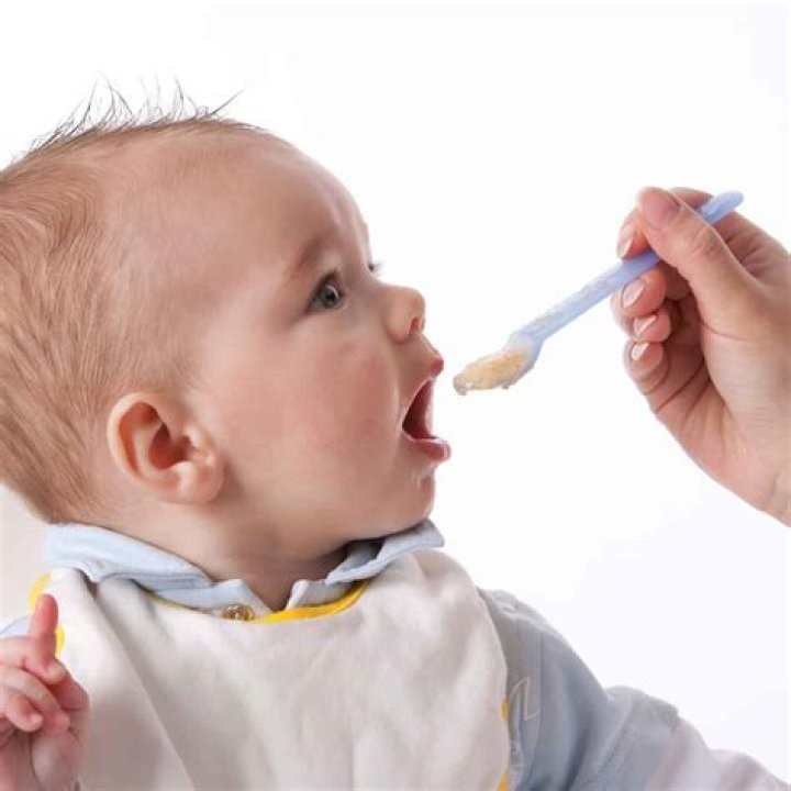 spoon feeding the baby