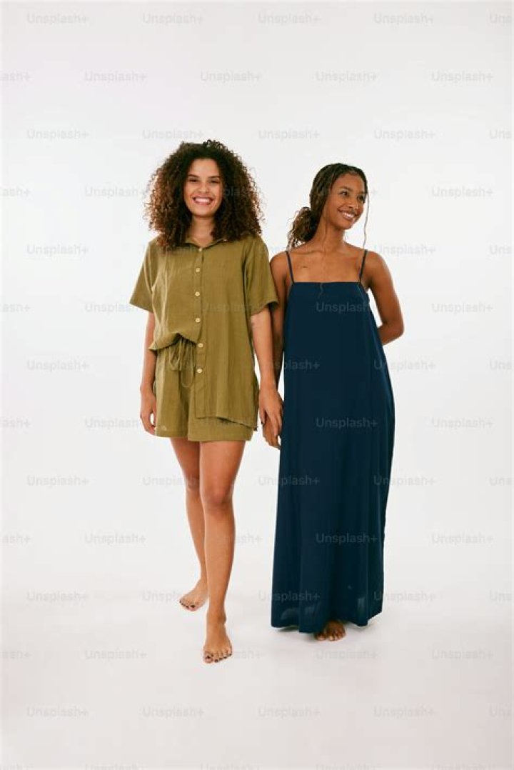 two women standing next to each other smiling