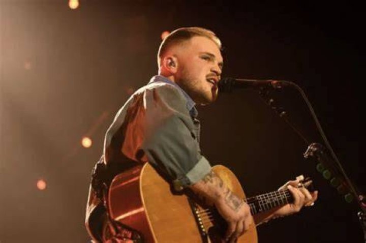 WATCH Zach Bryan Performs New Unreleased Song "Hey Driver" At Red Rocks