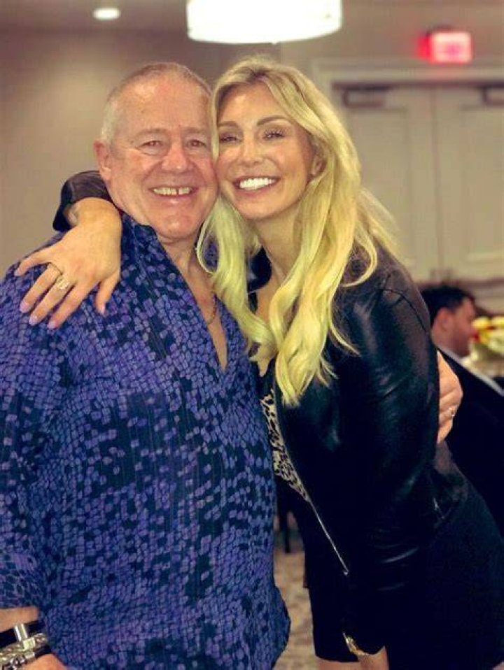 WWE Superstar Charlotte Flair (Ashley Fliehr) holding Monroe Sky