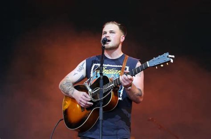 Zach Bryan Rules Emerging Artists Chart, Thanks to &lsquo;Something in the